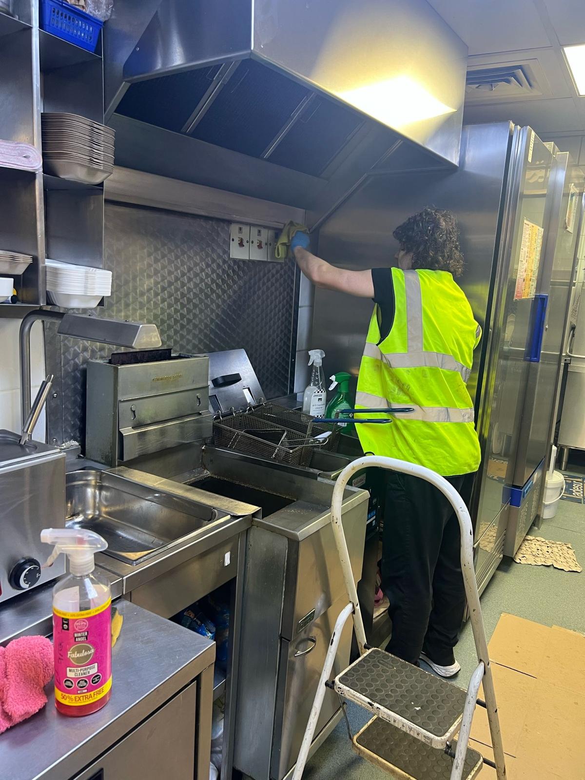 Cleaning stainless-steel surfaces in a commercial kitchen